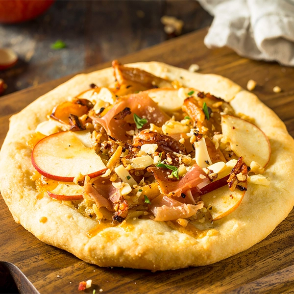 Caramelized Onion, Apple and Prosciutto Pizza with Cheddar Cheese